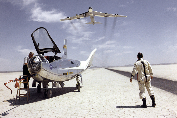 Space History Photo: HL-10 on Lakebed with B-52 Flyby